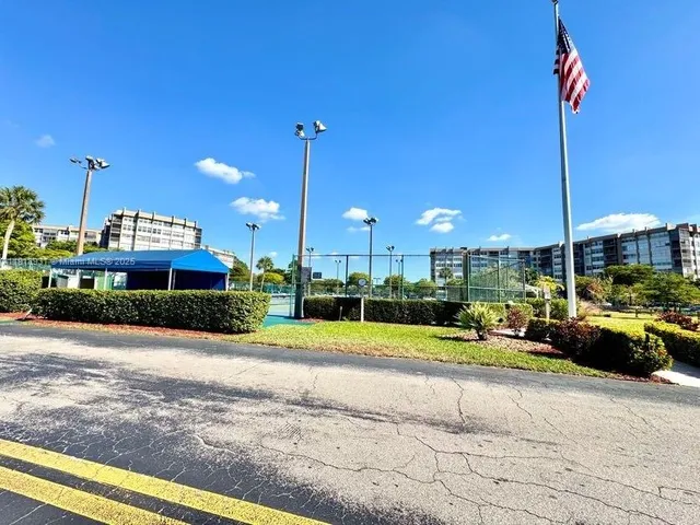 a view of a swimming pool and a yard