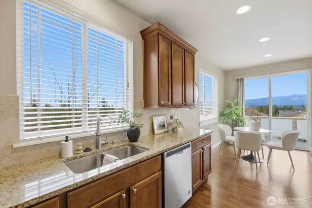 a kitchen with a sink stove and refrigerator