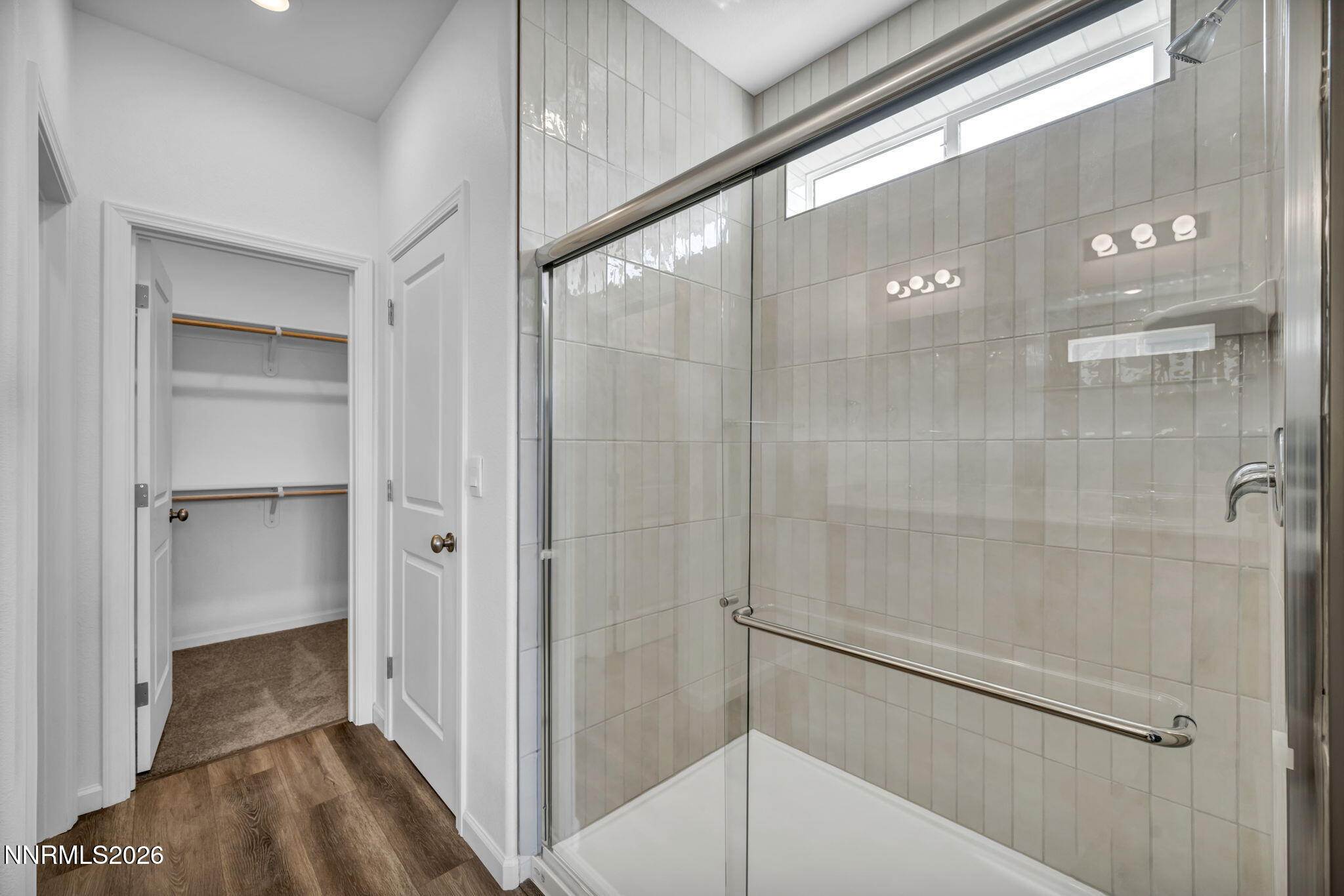 6676 Morgan Mill Road, Unit HOMESITE 14 Carson City, NV 89701 - Photo 17 of 24 a bathroom with a shower and a glass door