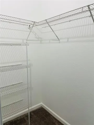 a view of a room with racks on the wall