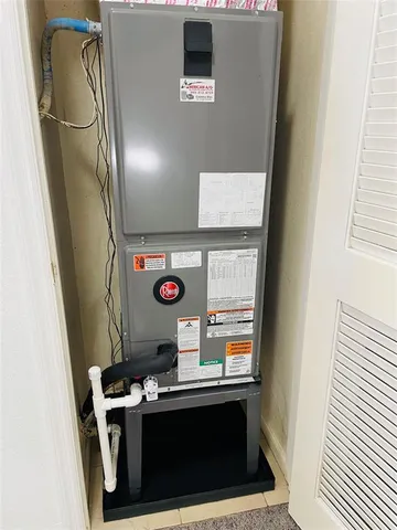 a view of washer and dryer with wooden door