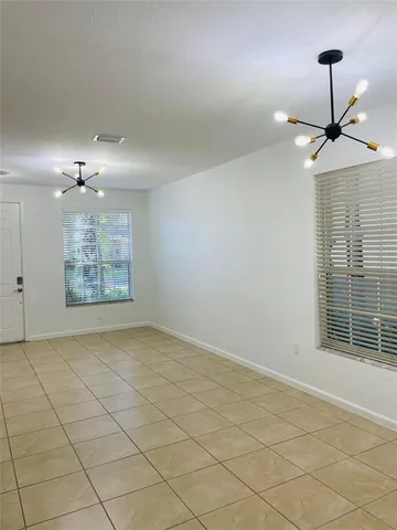 a view of an empty room and a window