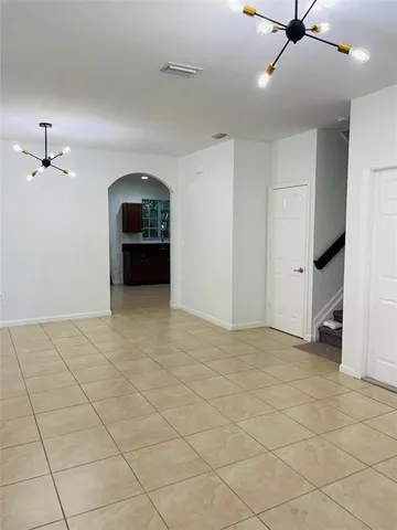 a view of a livingroom with a furniture and a ceiling fan
