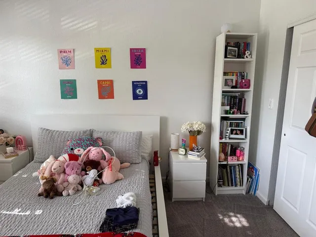 a bedroom with baby toys