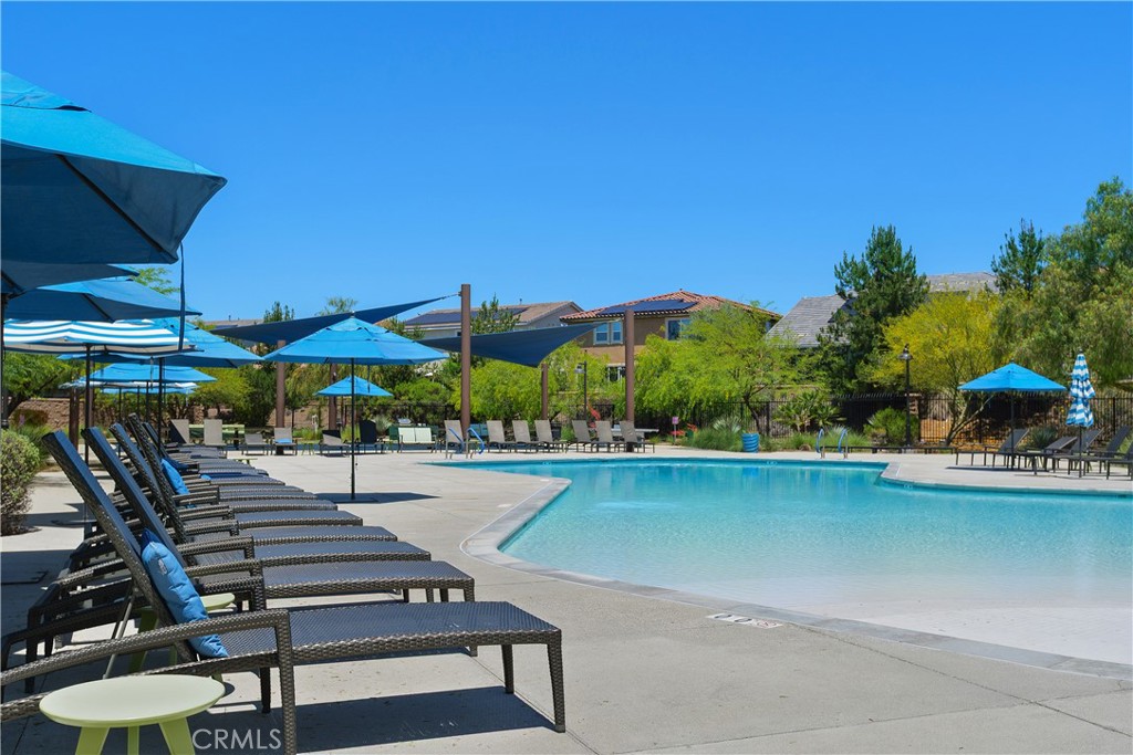 34727 Ribbon Grass Way Murrieta, CA 92563 - Photo 34 of 54 The Oasis is a premier 3-acre resort-style retreat featuring two sparkling pools, spacious sun decks, firepits, BBQ areas, shaded seating, and open lawn spaces for relaxing, gathering, and year-round enjoyment.