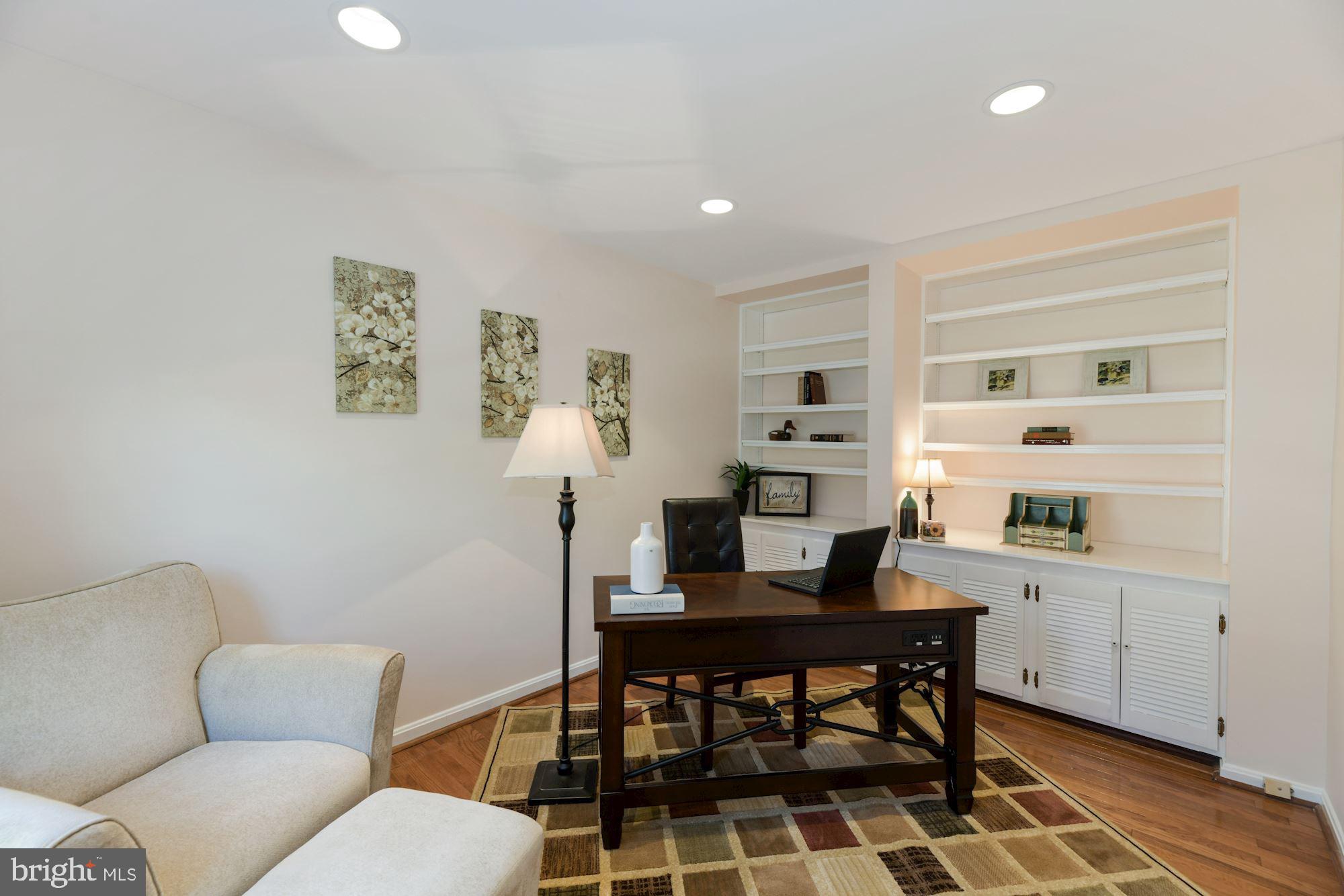 8427 Forrester Boulevard Springfield, VA 22152 - Photo 14 of 49 main level bedroom/office with built-in shelving