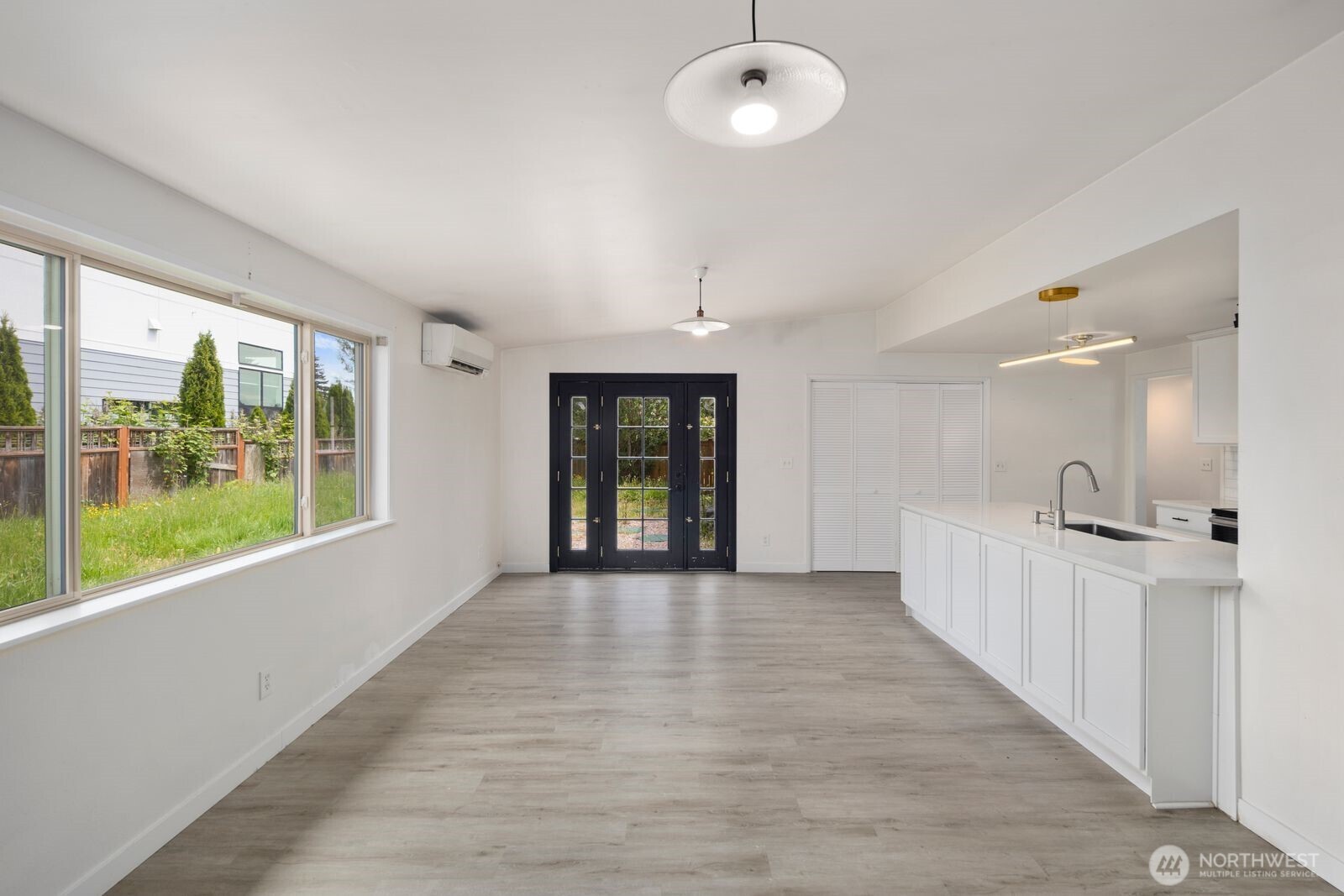 101 161st Street Southeast Bothell, WA 98012 - Photo 24 of 34 a view of an empty room with a window and wooden floor