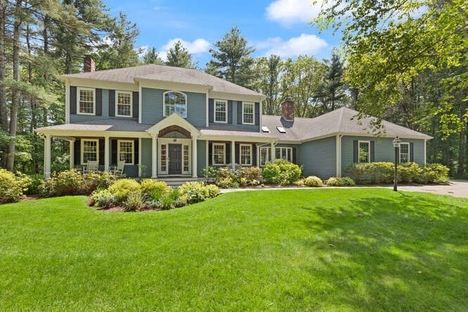 51 Fox Run Road Sudbury, MA 01776 - Photo 1 of 37 a front view of a house with a garden