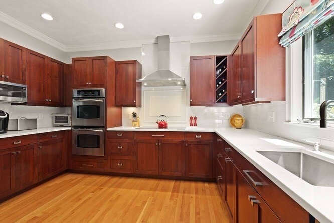 51 Fox Run Road Sudbury, MA 01776 - Photo 13 of 37 a kitchen with stainless steel appliances sink a microwave and cabinets