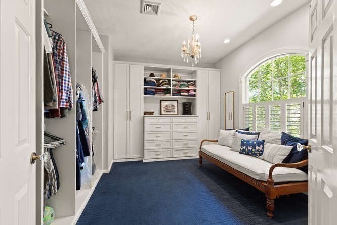 51 Fox Run Road Sudbury, MA 01776 - Photo 19 of 37 a spacious bedroom with furniture and a chandelier
