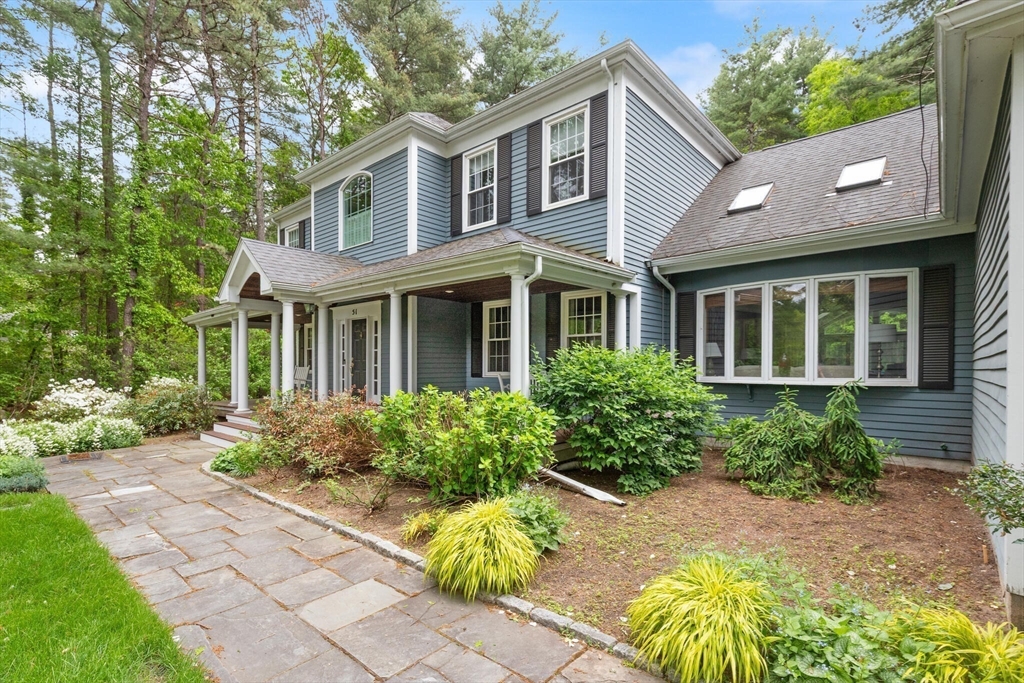 51 Fox Run Road Sudbury, MA 01776 - Photo 2 of 37 a front view of a house with garden