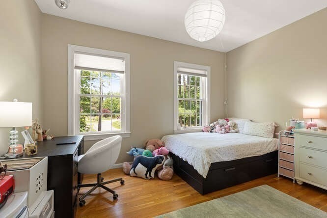 51 Fox Run Road Sudbury, MA 01776 - Photo 22 of 37 a bedroom with a bed table chair and a window