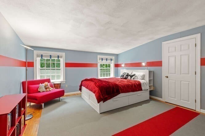 51 Fox Run Road Sudbury, MA 01776 - Photo 24 of 37 a bedroom with a bed and a couch