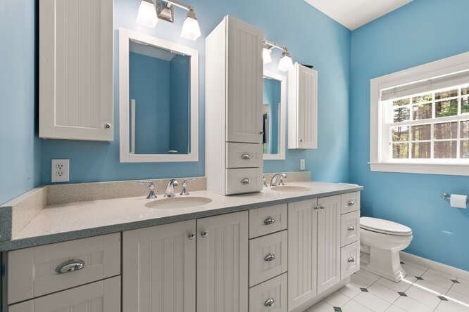 51 Fox Run Road Sudbury, MA 01776 - Photo 26 of 37 a bathroom with a toilet sink and mirror