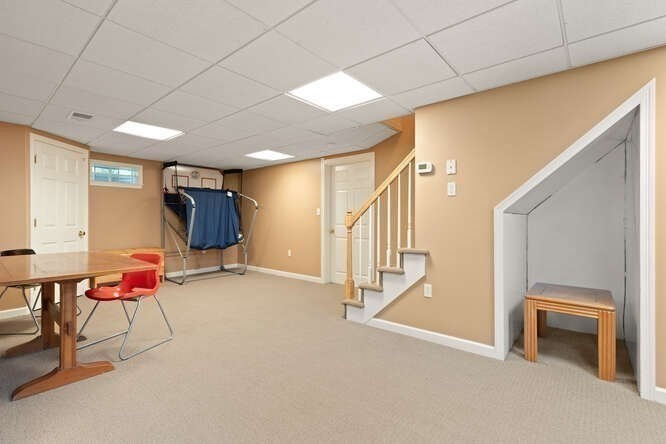 51 Fox Run Road Sudbury, MA 01776 - Photo 30 of 37 a view of an empty room with stairs and a window