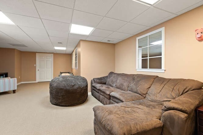 51 Fox Run Road Sudbury, MA 01776 - Photo 31 of 37 a living room with furniture a couch and a window