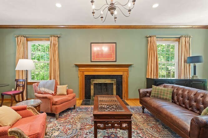51 Fox Run Road Sudbury, MA 01776 - Photo 6 of 37 a living room with furniture a rug and a fireplace