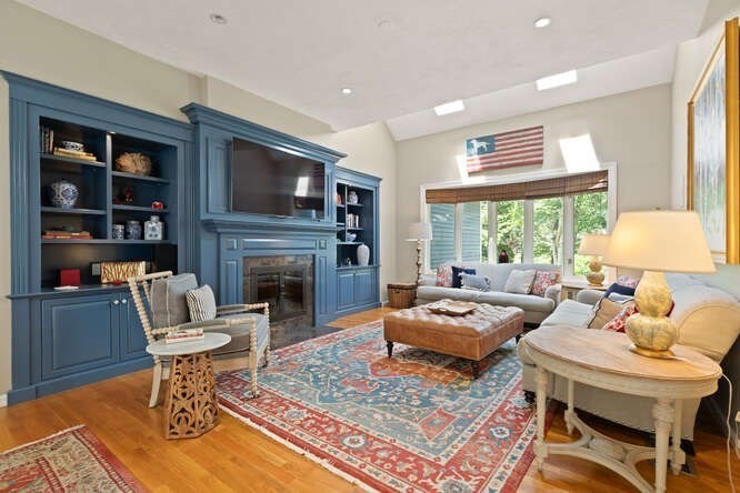 51 Fox Run Road Sudbury, MA 01776 - Photo 7 of 37 a living room with furniture a flat screen tv and a fireplace