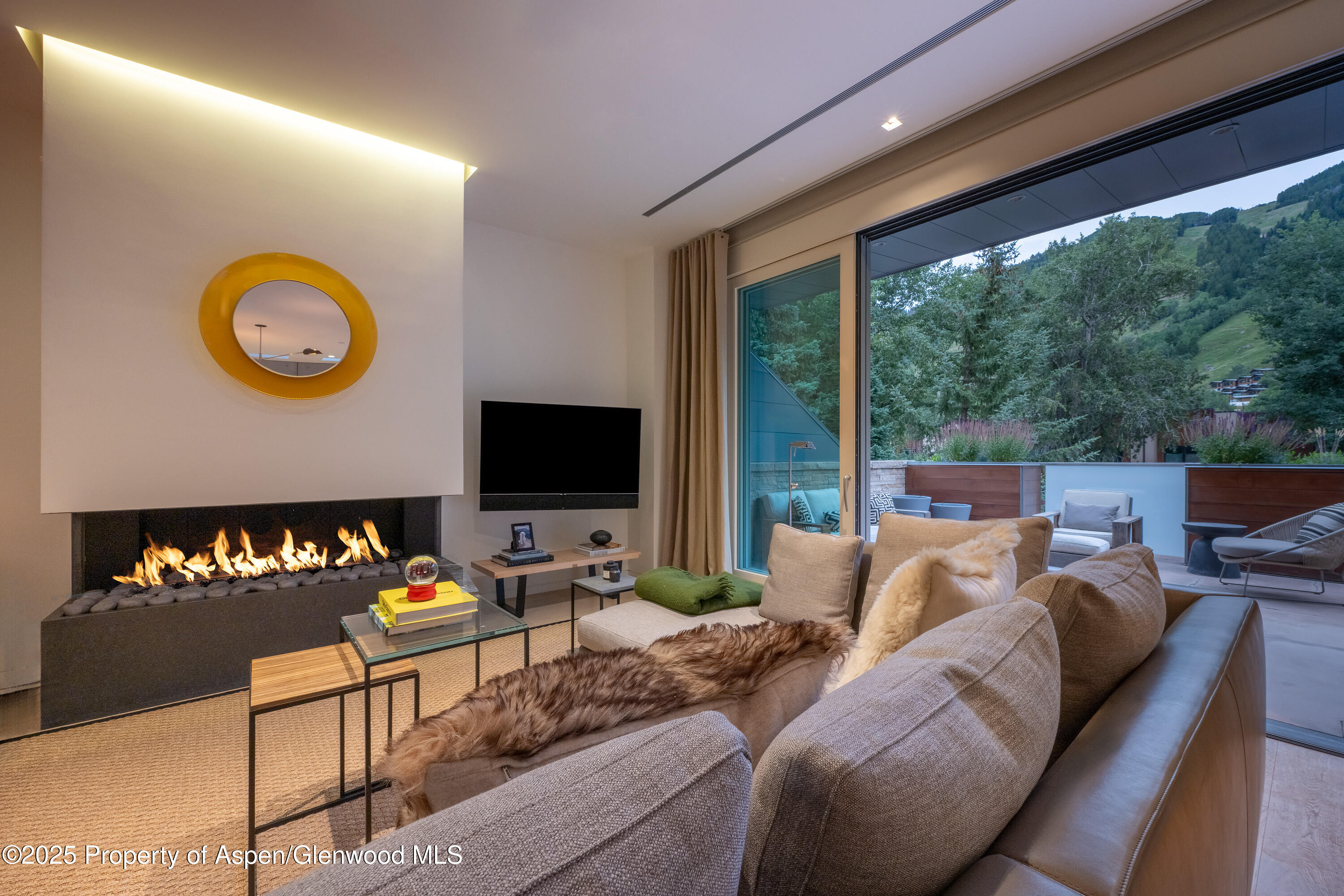 a bedroom with furniture and a flat screen tv