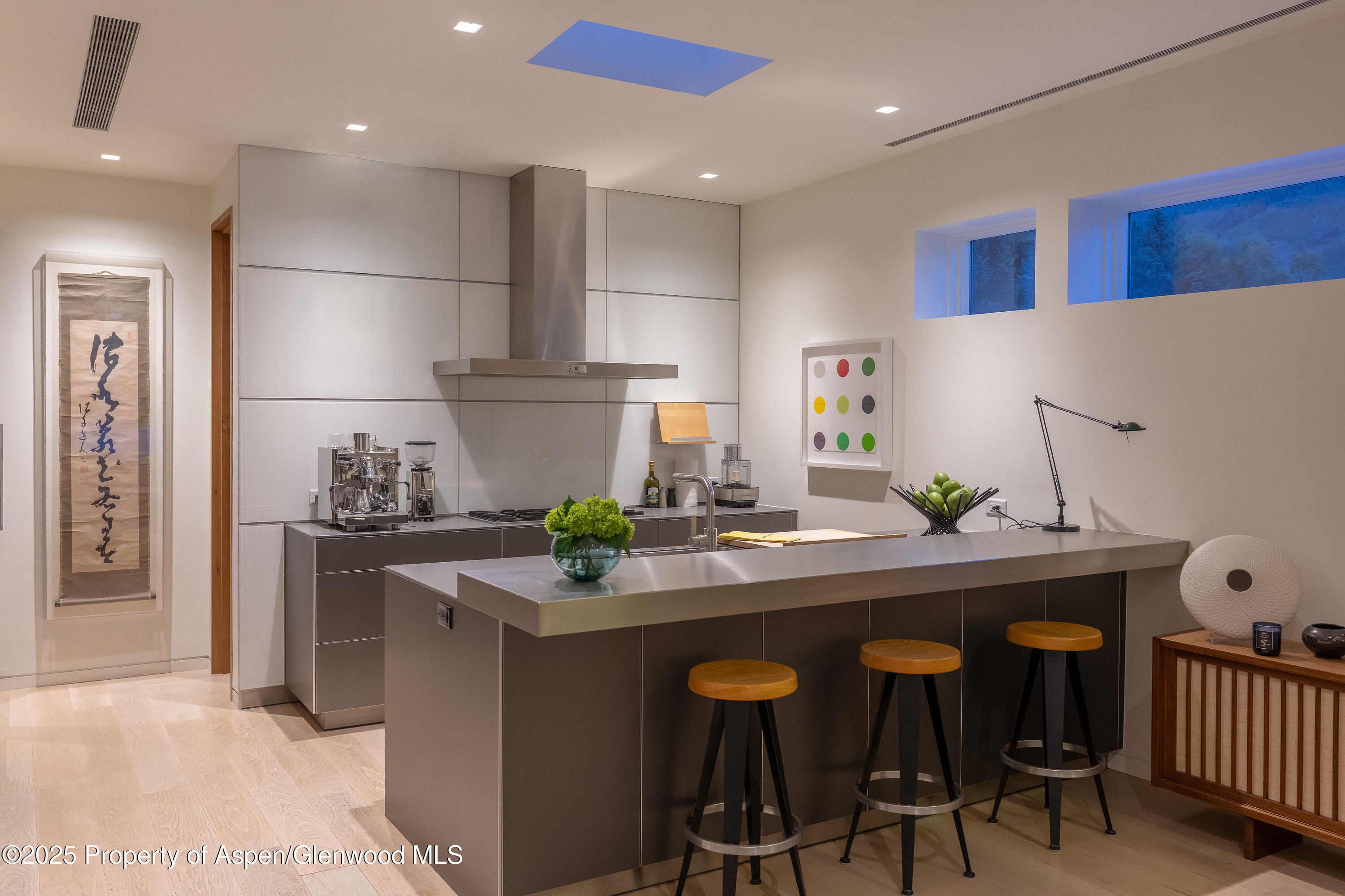 100 East Cooper Avenue, Unit 11 Aspen, CO 81611 - Photo 12 of 44 a kitchen with stainless steel appliances granite countertop a sink and a refrigerator