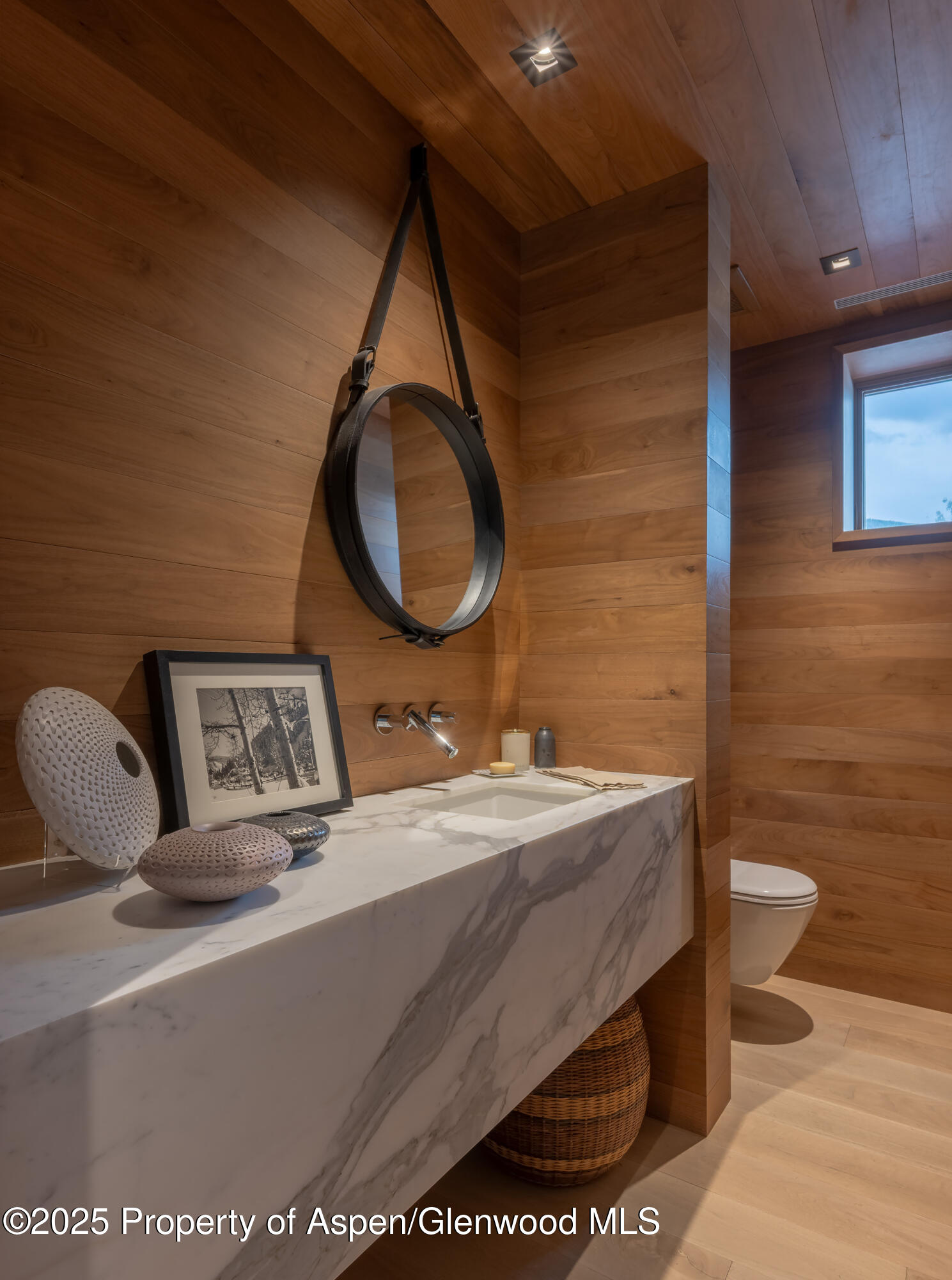 100 East Cooper Avenue, Unit 11 Aspen, CO 81611 - Photo 19 of 44 a bathroom with a sink a toilet and a mirror