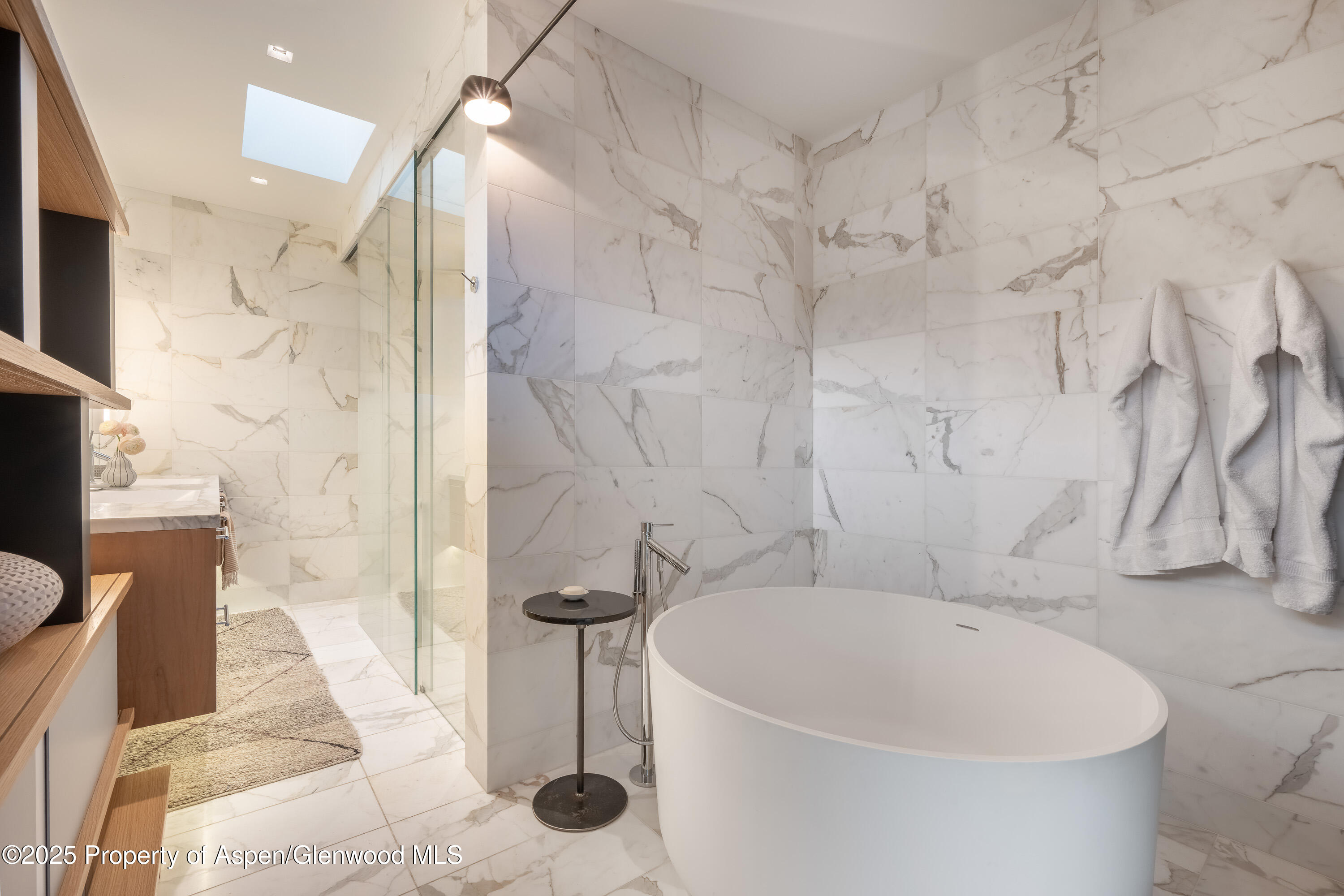 100 East Cooper Avenue, Unit 11 Aspen, CO 81611 - Photo 25 of 44 a bathroom with a bathtub and shower