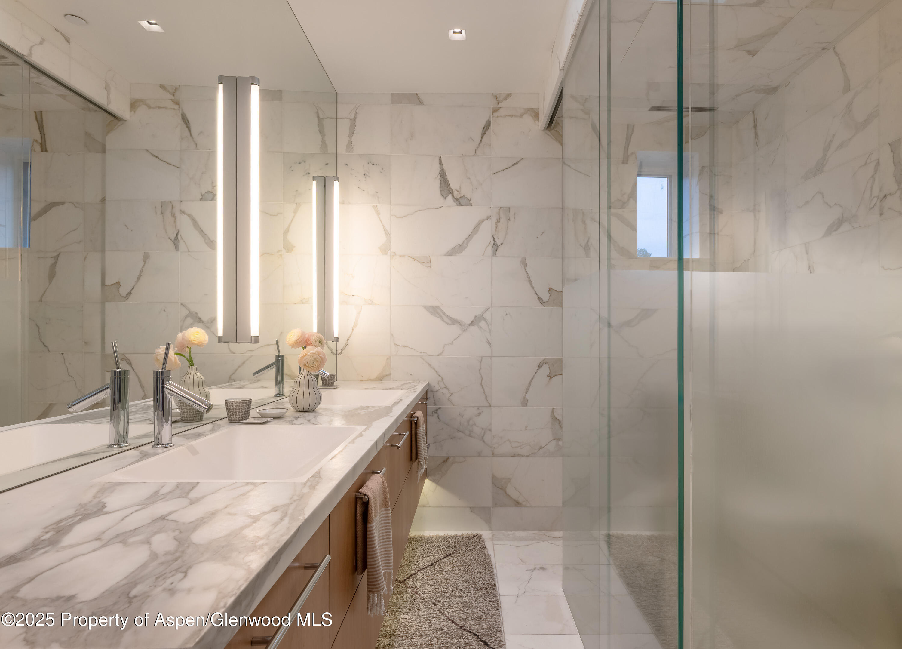 100 East Cooper Avenue, Unit 11 Aspen, CO 81611 - Photo 26 of 44 a bathroom with a sink and a mirror