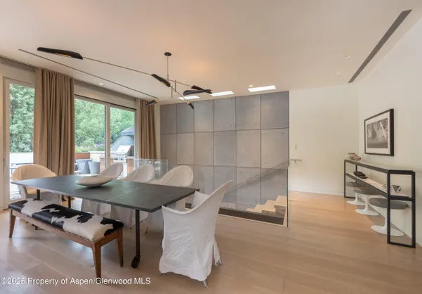 a dining room with furniture and window