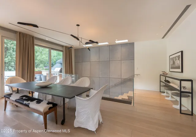 a dining room with furniture and window