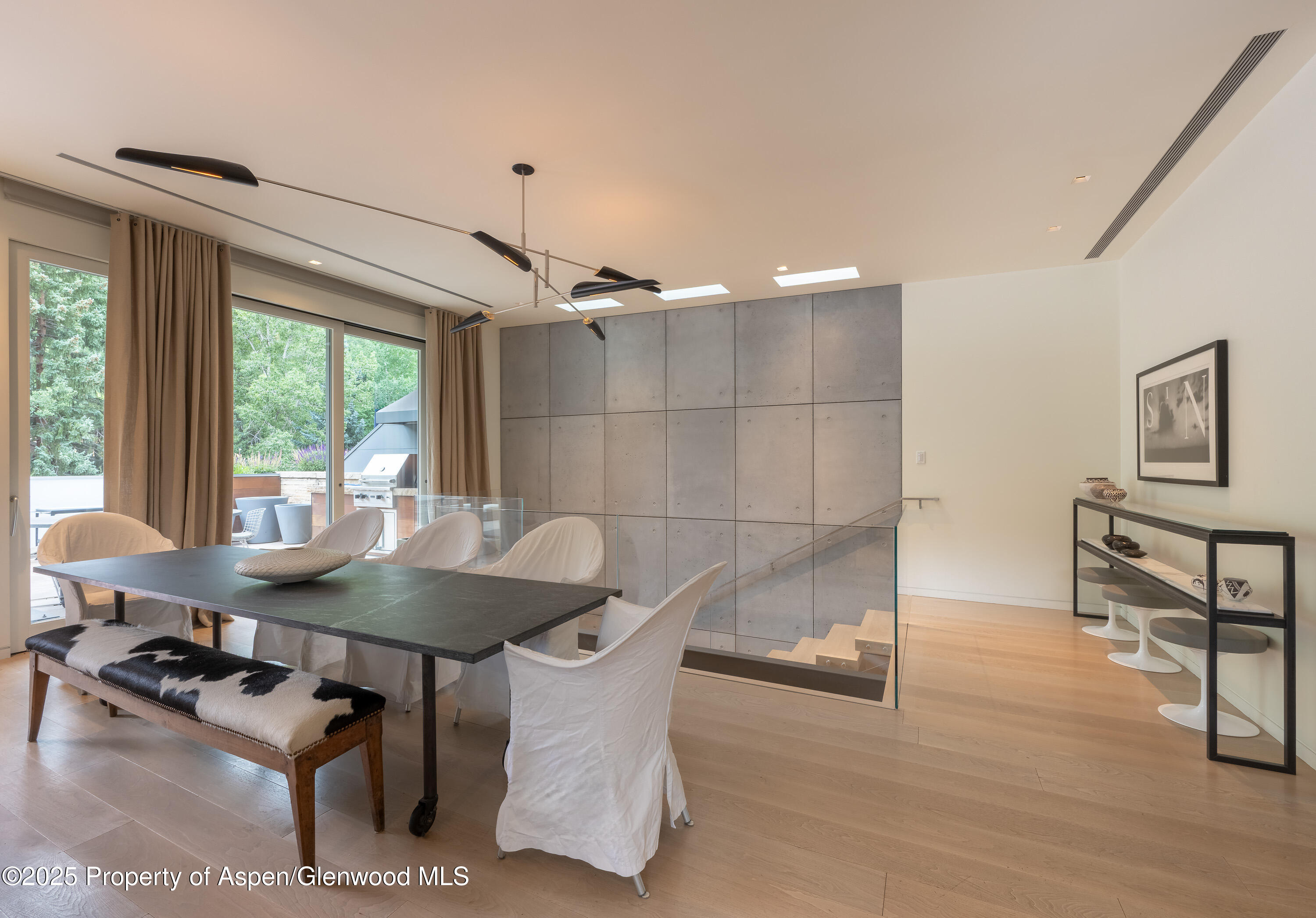 100 East Cooper Avenue, Unit 11 Aspen, CO 81611 - Photo 3 of 44 a dining room with furniture and window