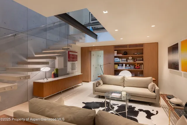 a living room with furniture and a couch