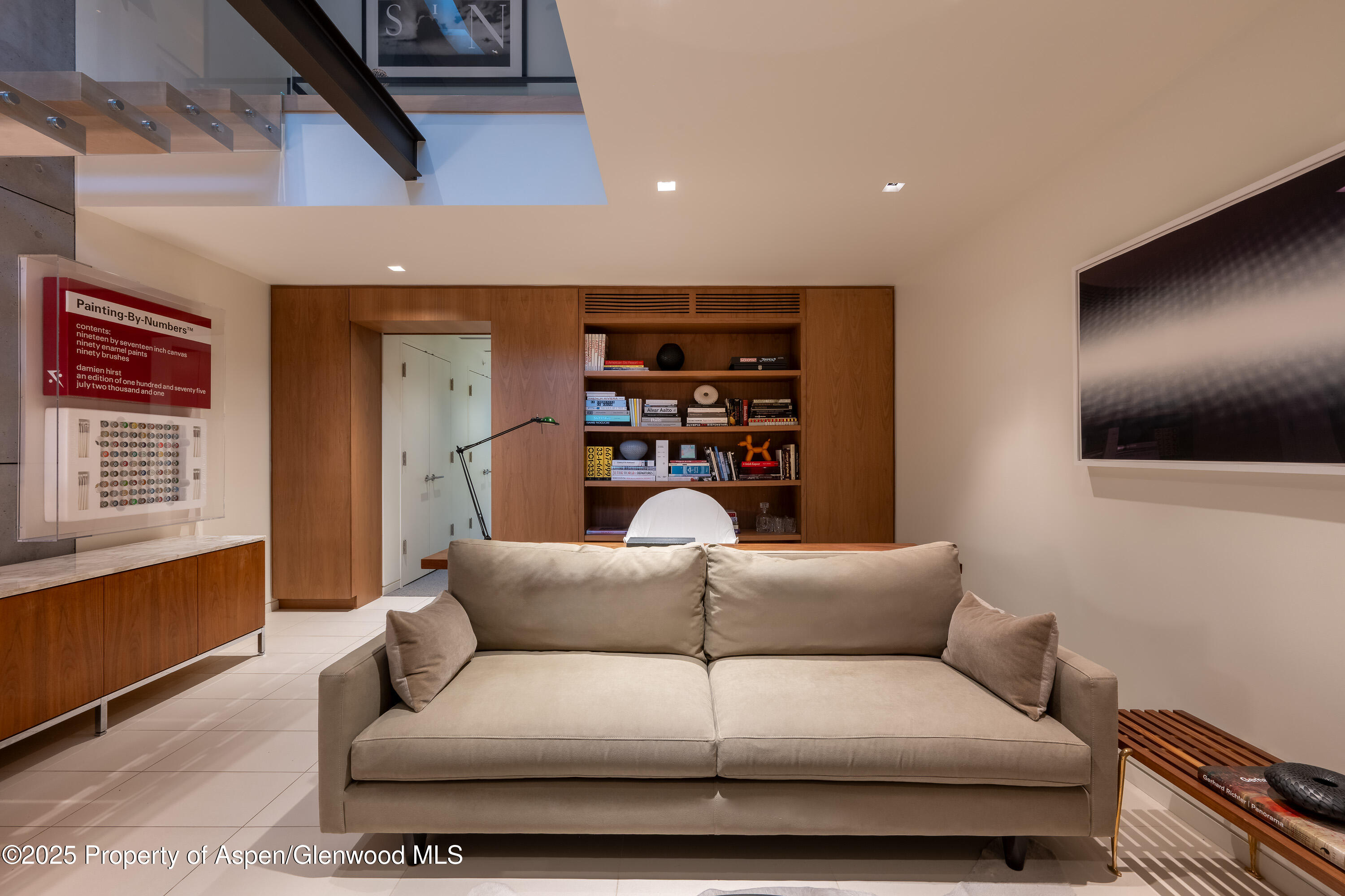 100 East Cooper Avenue, Unit 11 Aspen, CO 81611 - Photo 34 of 44 a living room with furniture and a flat screen tv