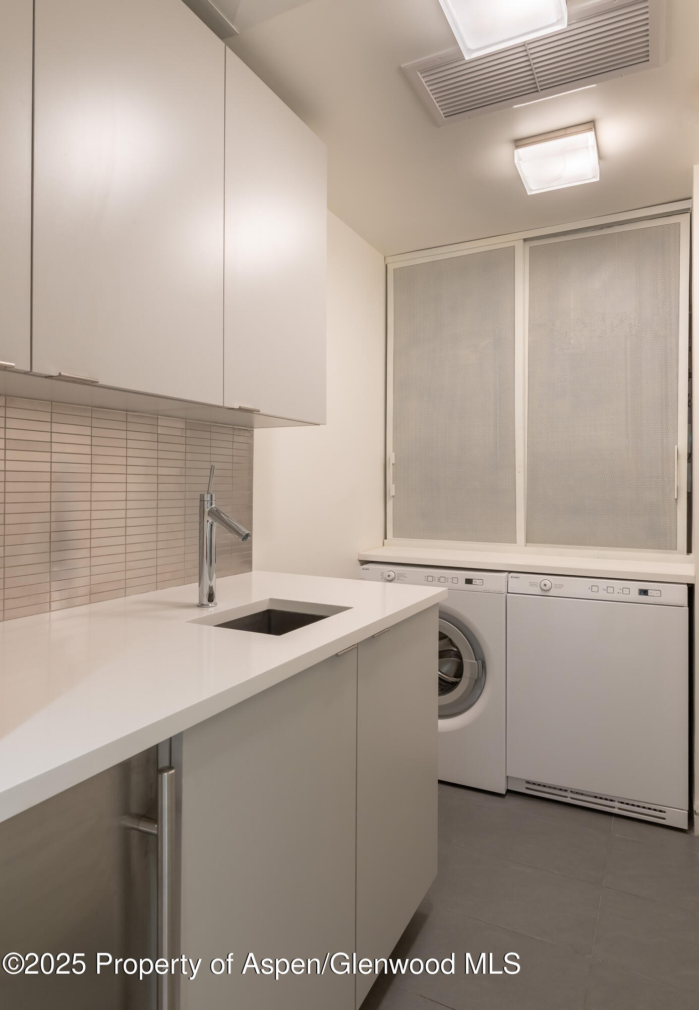100 East Cooper Avenue, Unit 11 Aspen, CO 81611 - Photo 37 of 44 a kitchen with a sink and cabinets