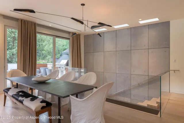 a view of a dining room with furniture window and outside view