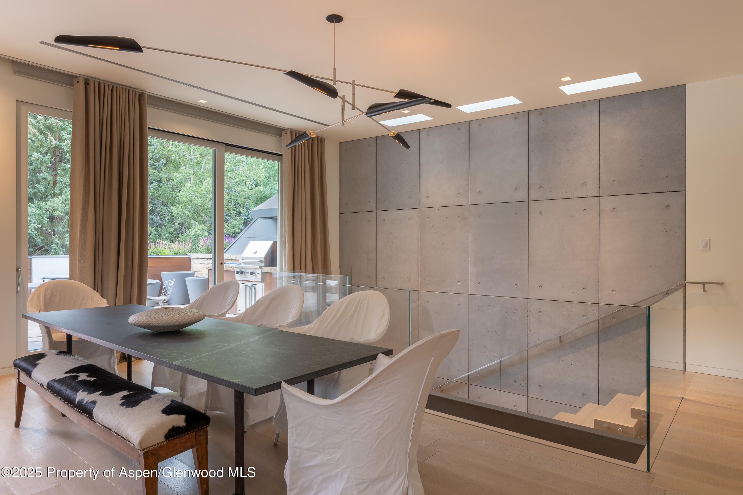 100 East Cooper Avenue, Unit 11 Aspen, CO 81611 - Photo 4 of 44 a view of a dining room with furniture window and outside view