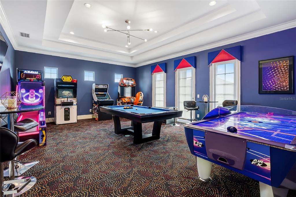 580 Muirfield Loop Reunion, FL 34747 - Photo 20 of 55 a living room with furniture and a flat screen tv