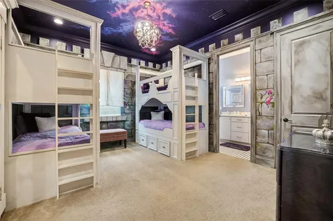 a kitchen with stainless steel appliances kitchen island granite countertop a refrigerator and a sink