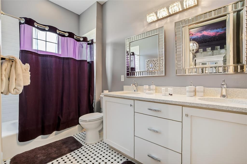 580 Muirfield Loop Reunion, FL 34747 - Photo 26 of 55 a bathroom with a sink and a mirror