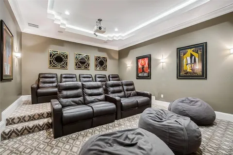 a hallway with wooden floor and staircase