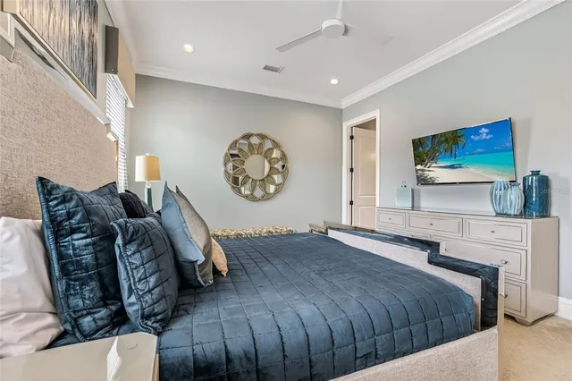 a bedroom with a large bed and a balcony view