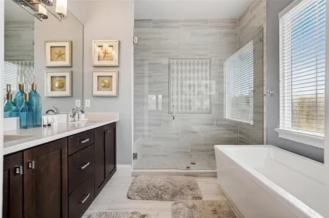 a dining room with furniture and a floor to ceiling window
