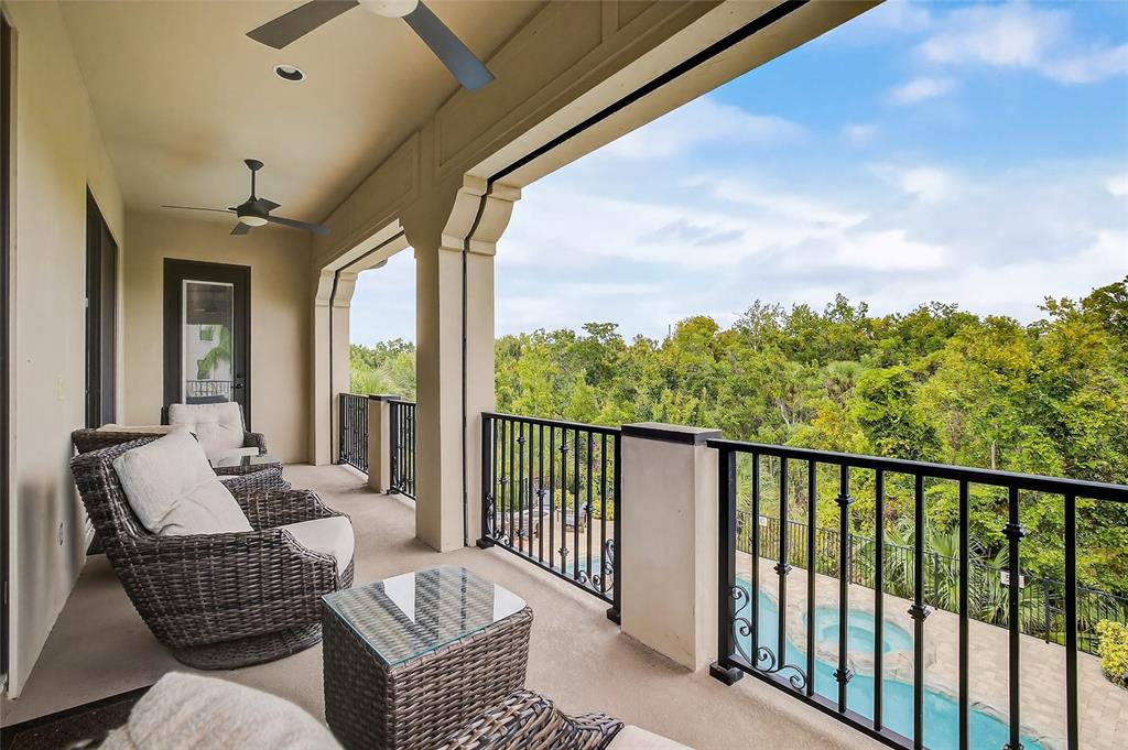 580 Muirfield Loop Reunion, FL 34747 - Photo 37 of 55 a balcony with furniture and a view of city from balcony