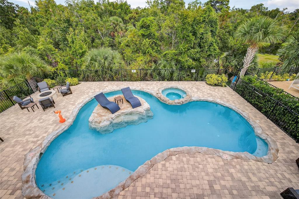580 Muirfield Loop Reunion, FL 34747 - Photo 38 of 55 an aerial view of a house with outdoor space