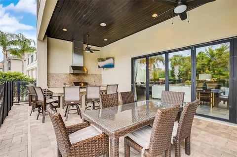 a view of a house with swimming pool and sitting area