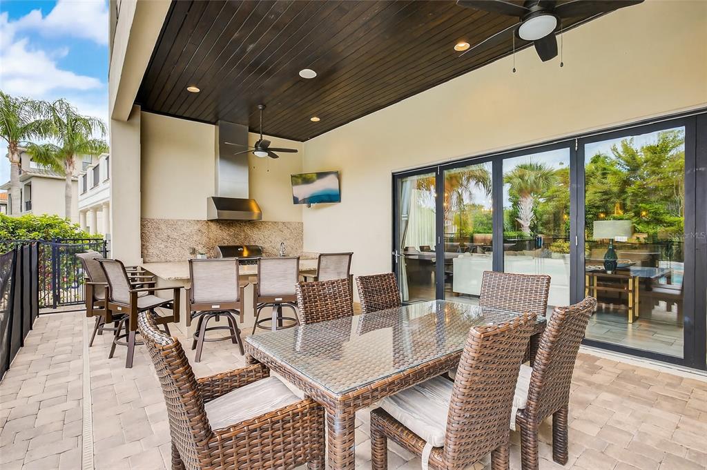 580 Muirfield Loop Reunion, FL 34747 - Photo 40 of 55 a dining room with furniture water view and a floor to ceiling window