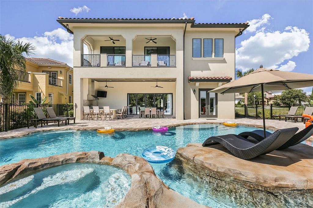 580 Muirfield Loop Reunion, FL 34747 - Photo 41 of 55 a view of a house with swimming pool and sitting area