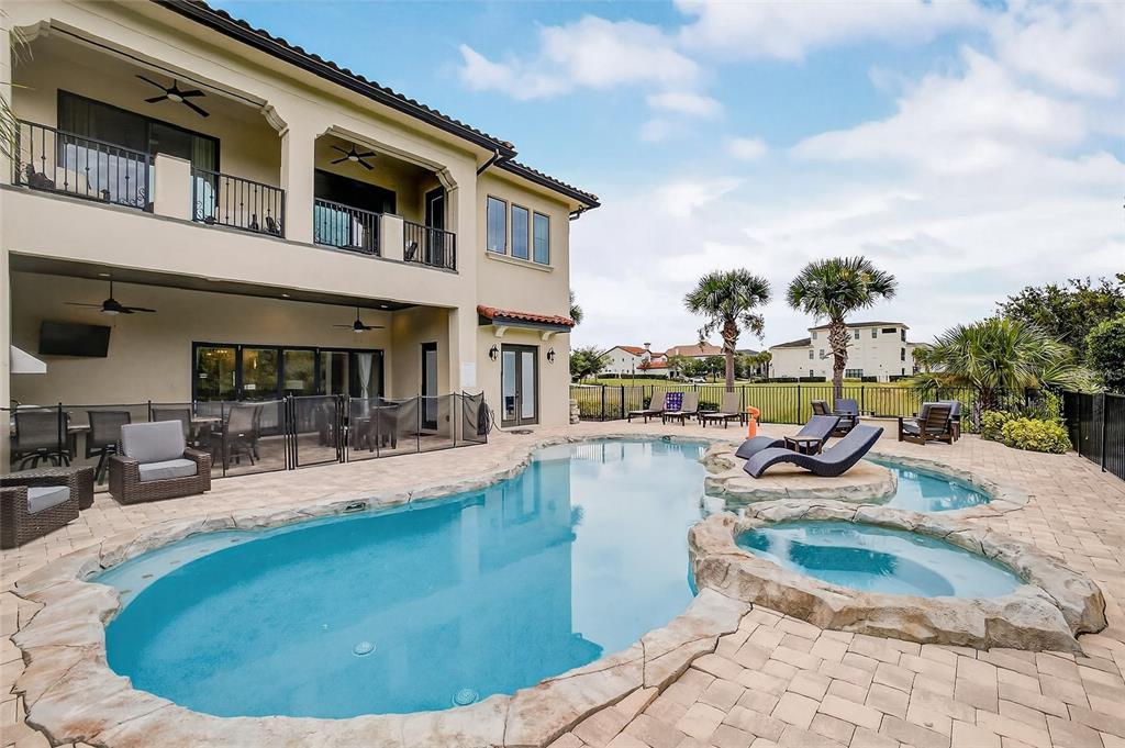 580 Muirfield Loop Reunion, FL 34747 - Photo 43 of 55 a view of a house with swimming pool and sitting area