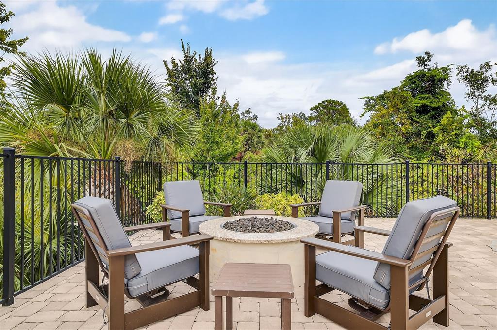 580 Muirfield Loop Reunion, FL 34747 - Photo 44 of 55 a patio with a yard table and chairs