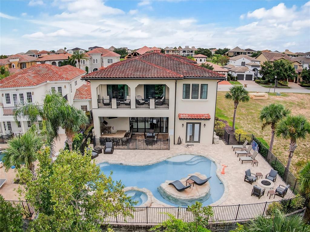 580 Muirfield Loop Reunion, FL 34747 - Photo 45 of 55 a view of a house with swimming pool and furniture