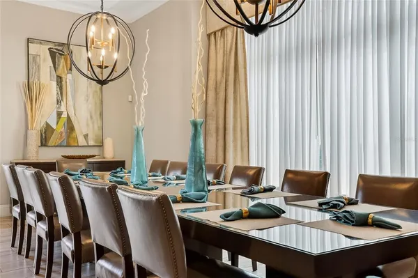 a dining room with furniture and a window